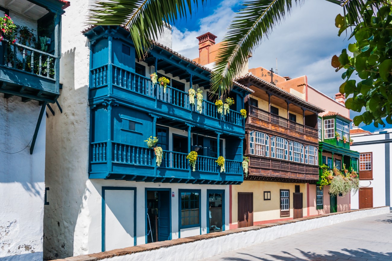 The 15th-century buildings featuring colourful balconies adorned with flowers in Santa Cruz de La Palma, Spain