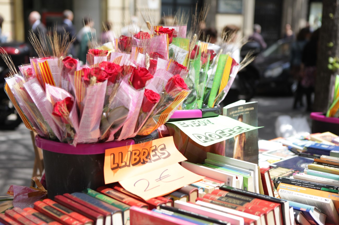 Books and roses on street stalls take over Las Ramblas during Sant Jordi Day in Barcelona, Spain